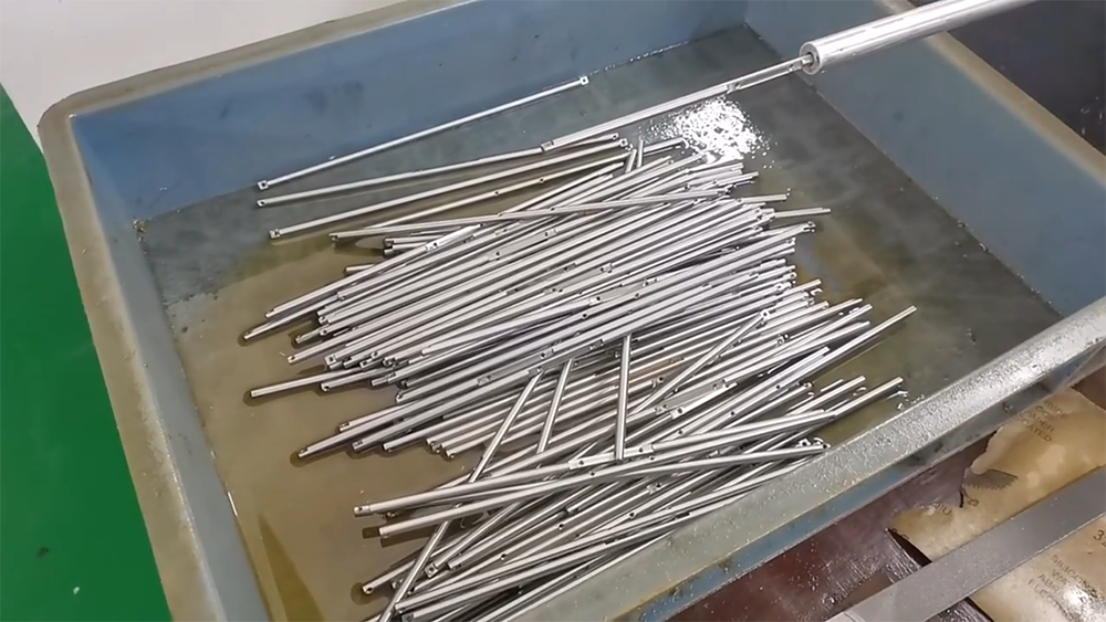 Swiss turning excels at small, long, thin parts — medical screws, pins, dental implants, and miniature shafts where traditional lathes cannot hold tolerance.